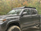 Front drivers side view of gray Toyota Tacoma with Premium roof rack - Cali Raised LED